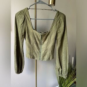 Green, eyelet corset top with puffy sleeves by Altar’d State